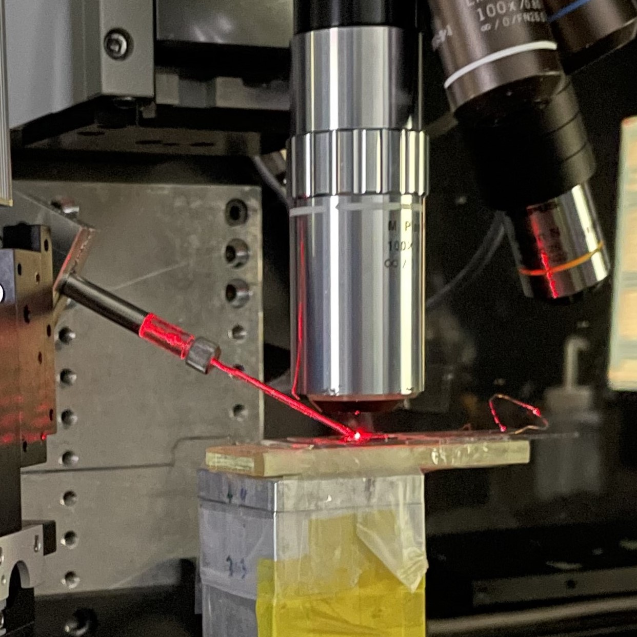 In this way, microdroplet measurements were performed simultaneously with Raman spectroscopy. A red laser-illuminated capillary is used for microdroplet formation, and an objective lens above it is used for visualization of microdroplets and samples and for the Raman spectral measurements.